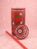 16oz strawberry snow globe tumbler with red glitter, strawberry and daisy design, red rhinestones, decorated strawberry lid and reusable striped straw.